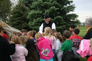 Captain Springer (Randy Cheatham) explains the duties of a Chaplain 